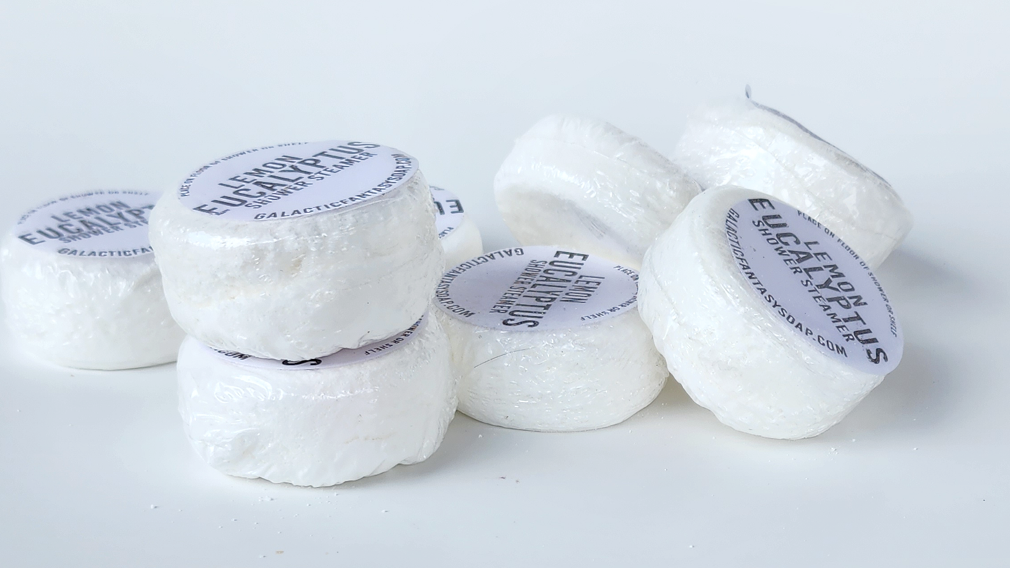 stacked lemon eucalyptus essential oil shower steamers in puck form white